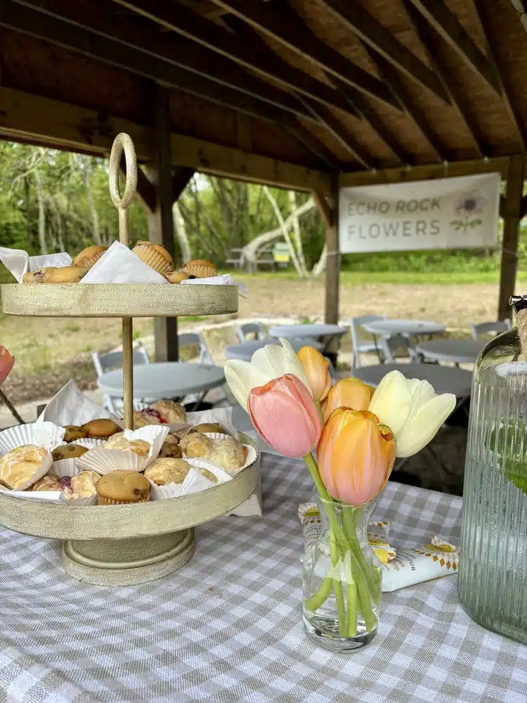 Flowers in a vase and pastries on a table at a flower workshop