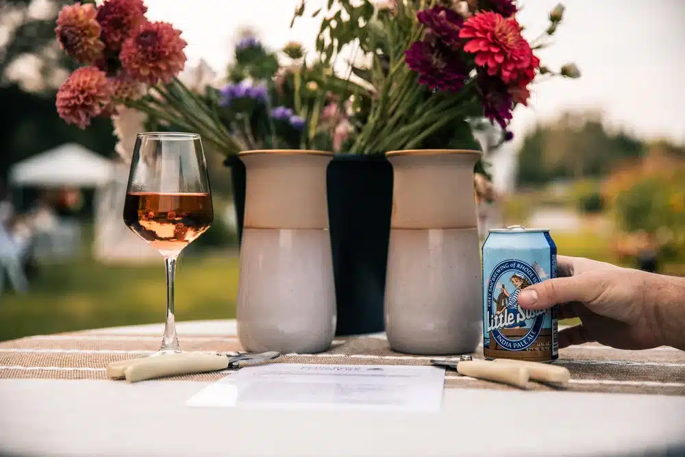 Beer, wine, and flowers on a table for date night amongst the flower farm