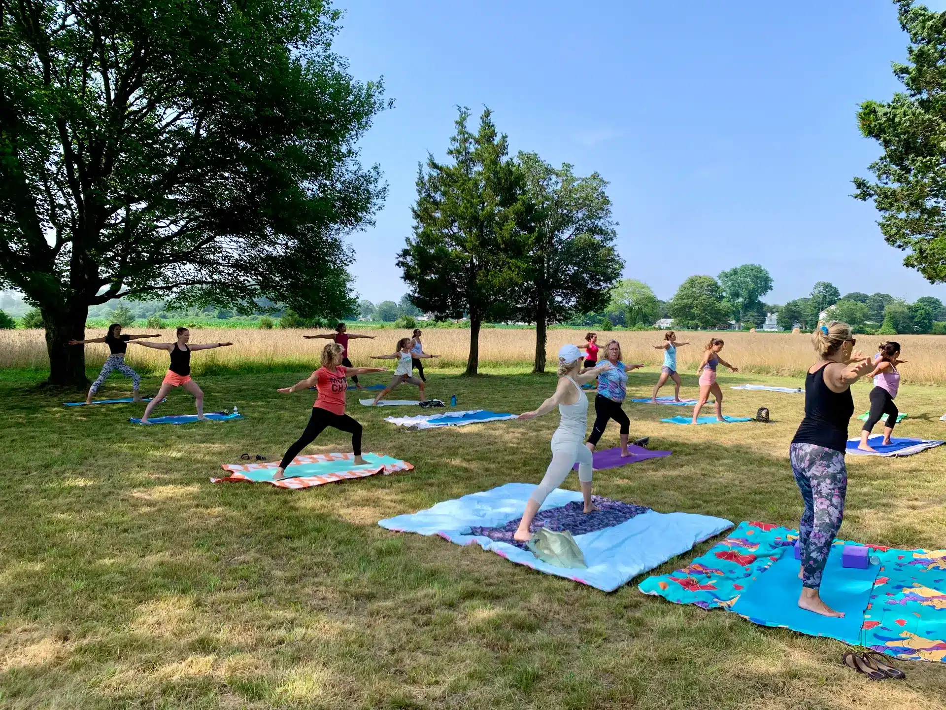 Participants practicing yoga at Winnapaug Farm Preserve